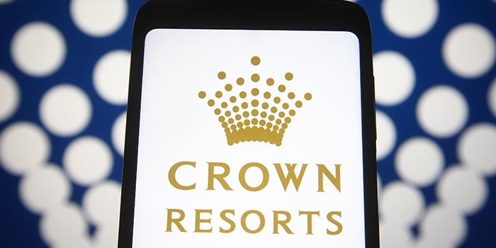 Crown Resorts' logo appears on a mobile device