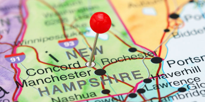 New Hampshire on the map of the US with a red pin dropped