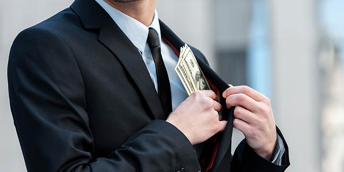 Man in a suit embezzles money