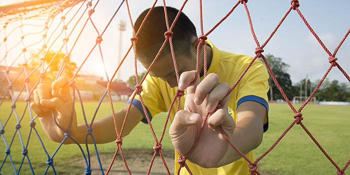 A crestfallen soccer athlete