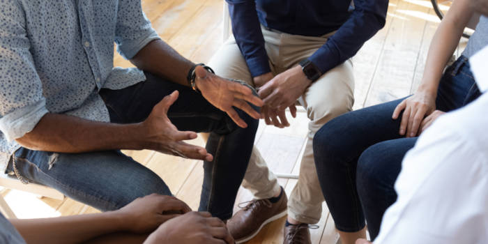 A group of people supporting each other.